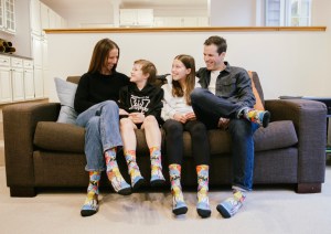 Eamonn Millar, 10, and his family, wearing socks Eamonn designed, are grateful for the support the BC Children's Hospital teamhas provided during Eamonn's cancer journey. Courtesy the Millar family