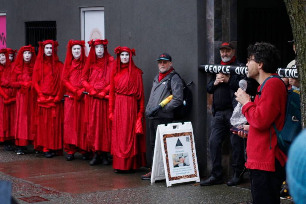 Proposed pipeline draws crimson-draped protesters to B.C. capital